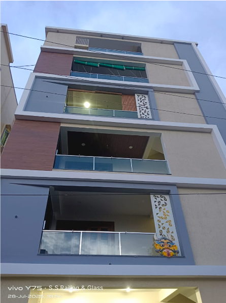 Expert technician repairing and maintaining stainless steel glass railing hardware